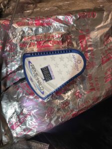 a pair of scissors sitting on top of a piece of tin foil