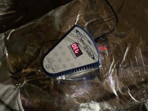 a close up of a tennis racquet on a plastic bag