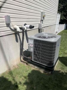 an air conditioner attached to the side of a house
