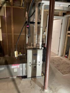 a room with a furnace and pipes in it