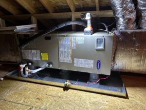 an air conditioner sitting on top of a wooden floor
