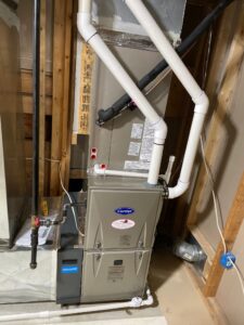 a furnace and a water heater in a room