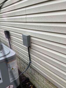 a water heater sitting next to a house