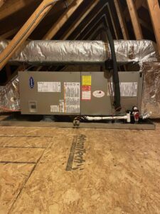 an air conditioner sitting on top of a wooden floor