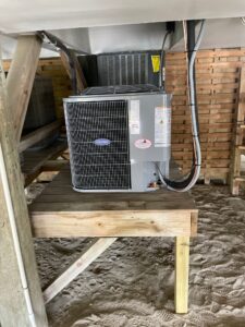 a air conditioner sitting on top of a wooden table