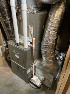 a furnace and a water heater in a room