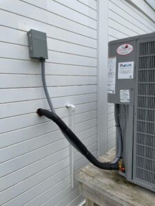 an air conditioner on the side of a house