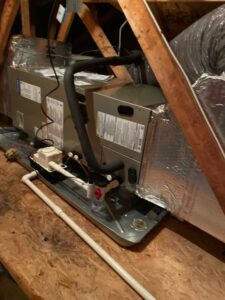 an air conditioner sitting on top of a wooden table