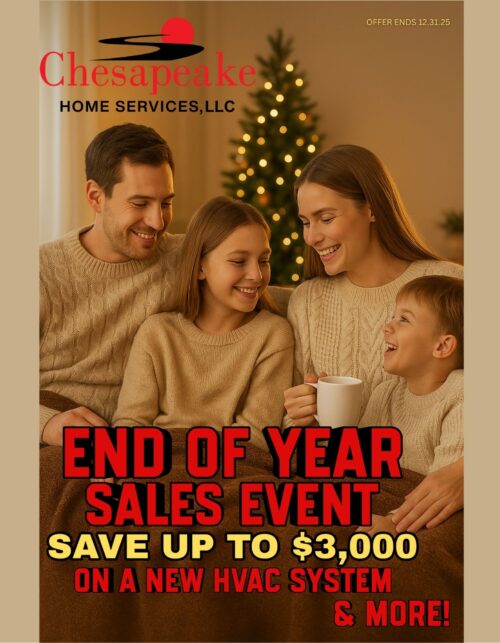 a family sitting on a couch in front of a christmas tree