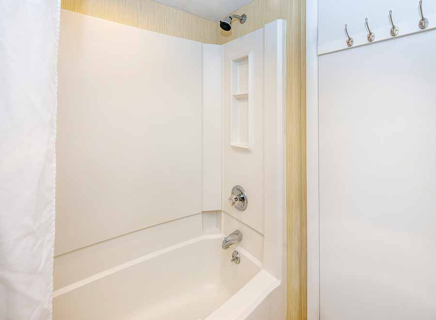 a bathroom with a bathtub and a shower