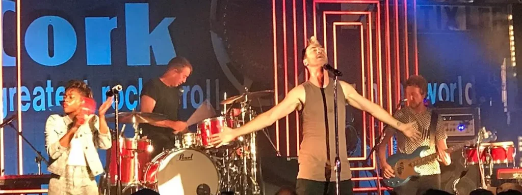 A band singing on stage