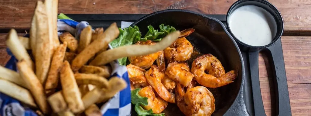 Cooked shrimp and fries on a plate