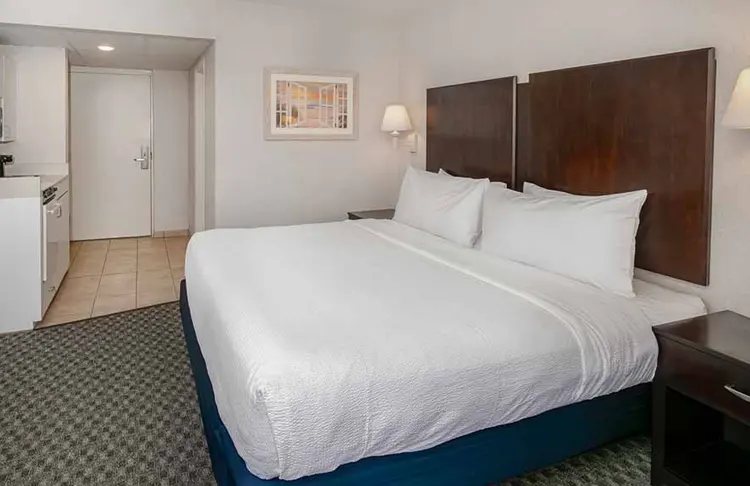 A king size bed in a hotel room.