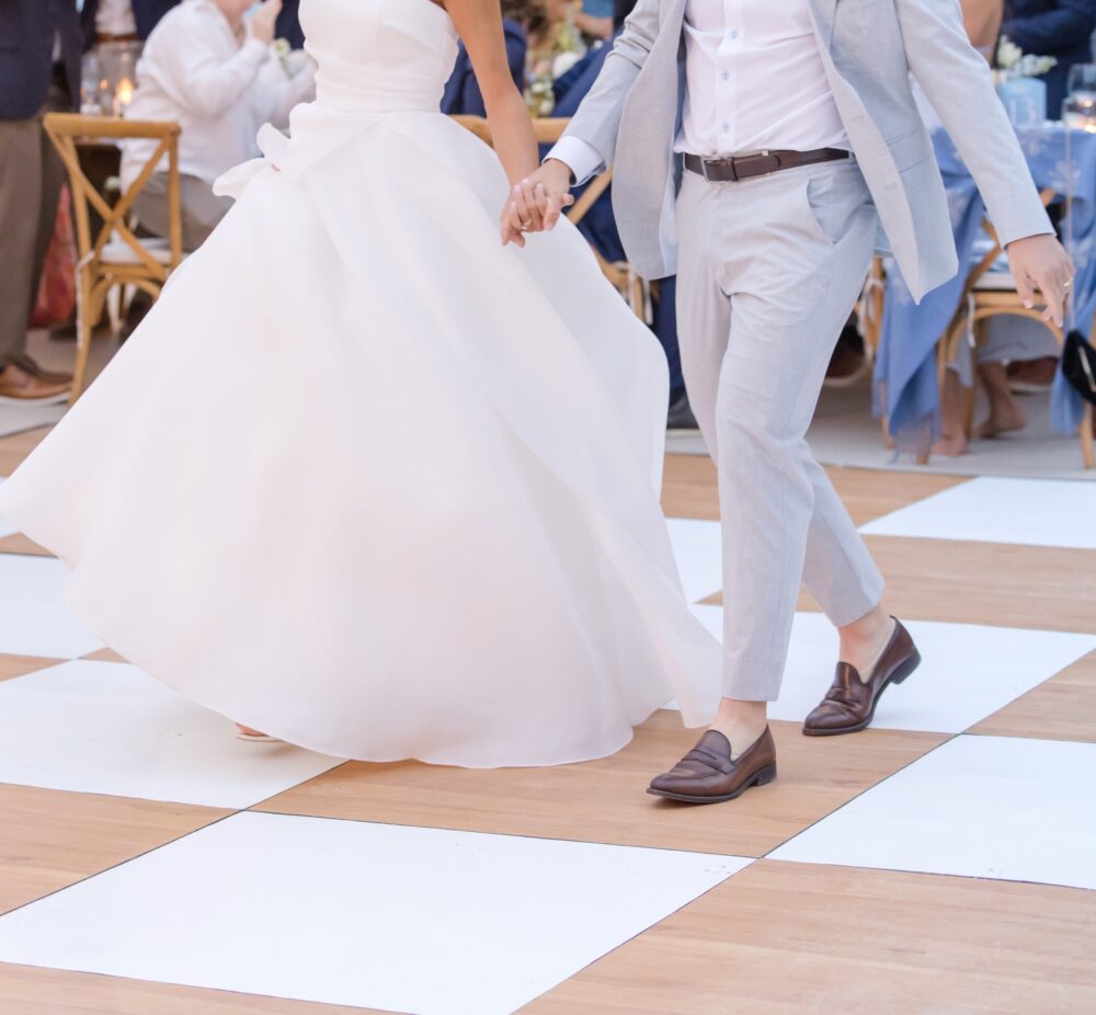tan and white dance floor with bride and groom