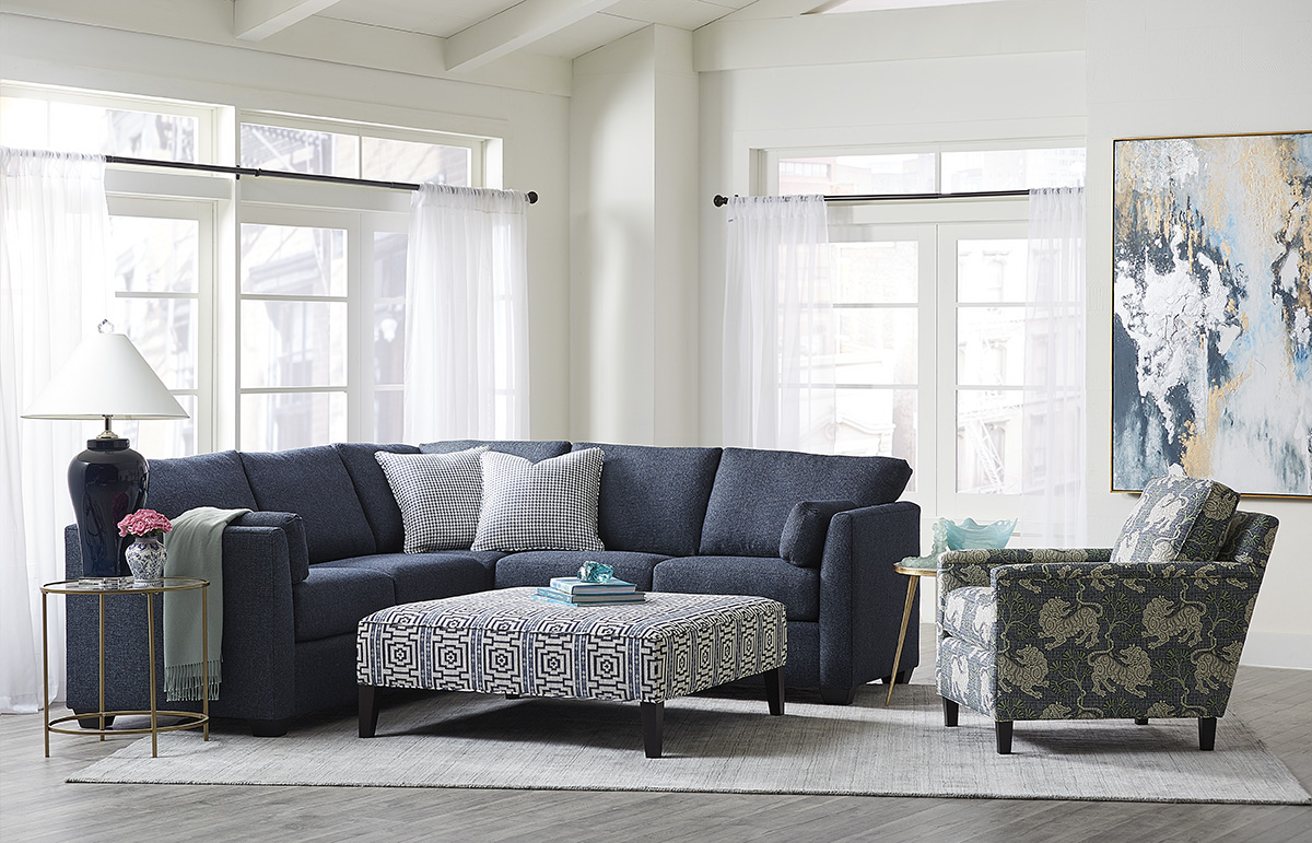 a living room filled with furniture and a large window