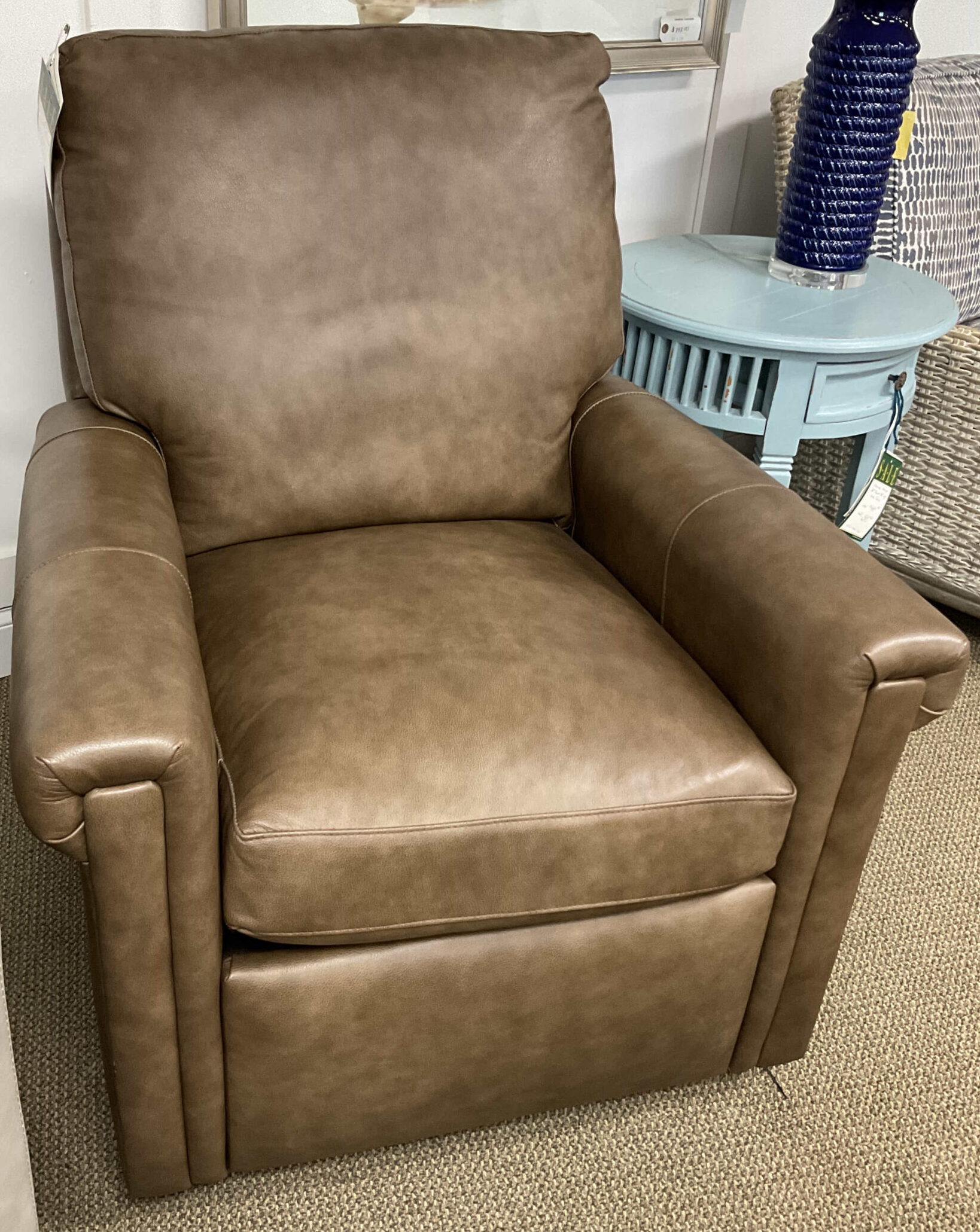a living room with a reclining chair and a hair dryer