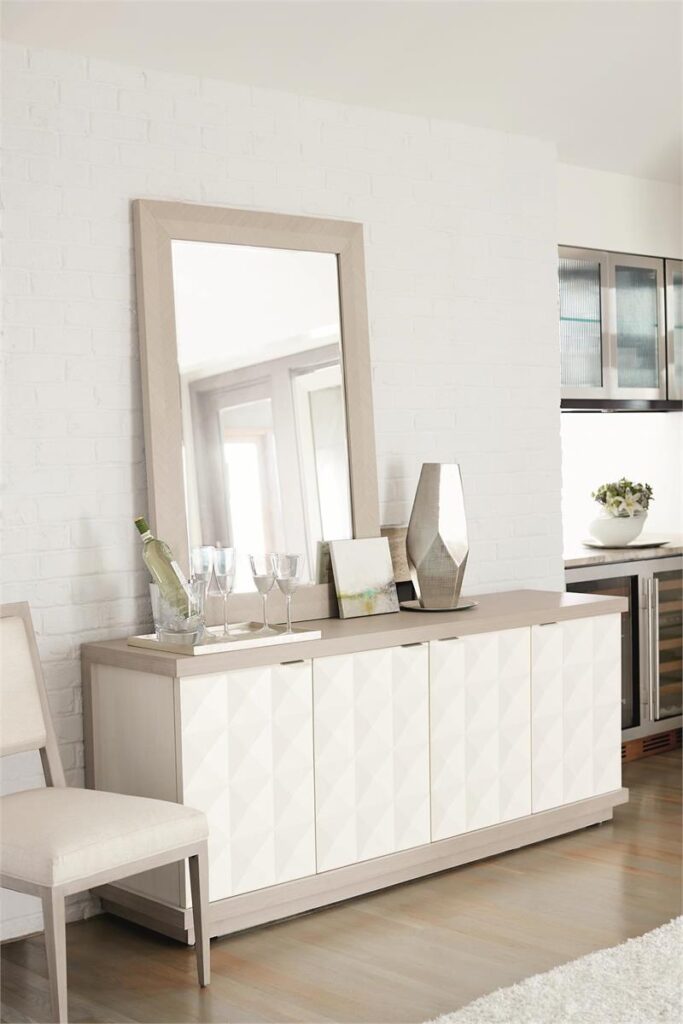 Thumbnail of http://a%20white%20dresser%20with%20a%20mirror%20and%20vases%20on%20it