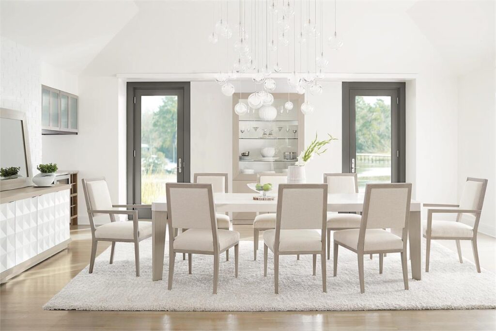 Thumbnail of http://a%20dining%20room%20table%20with%20chairs%20and%20a%20chandelier