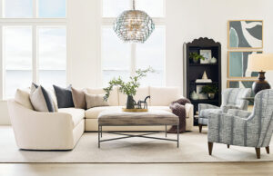 a living room filled with furniture and a chandelier