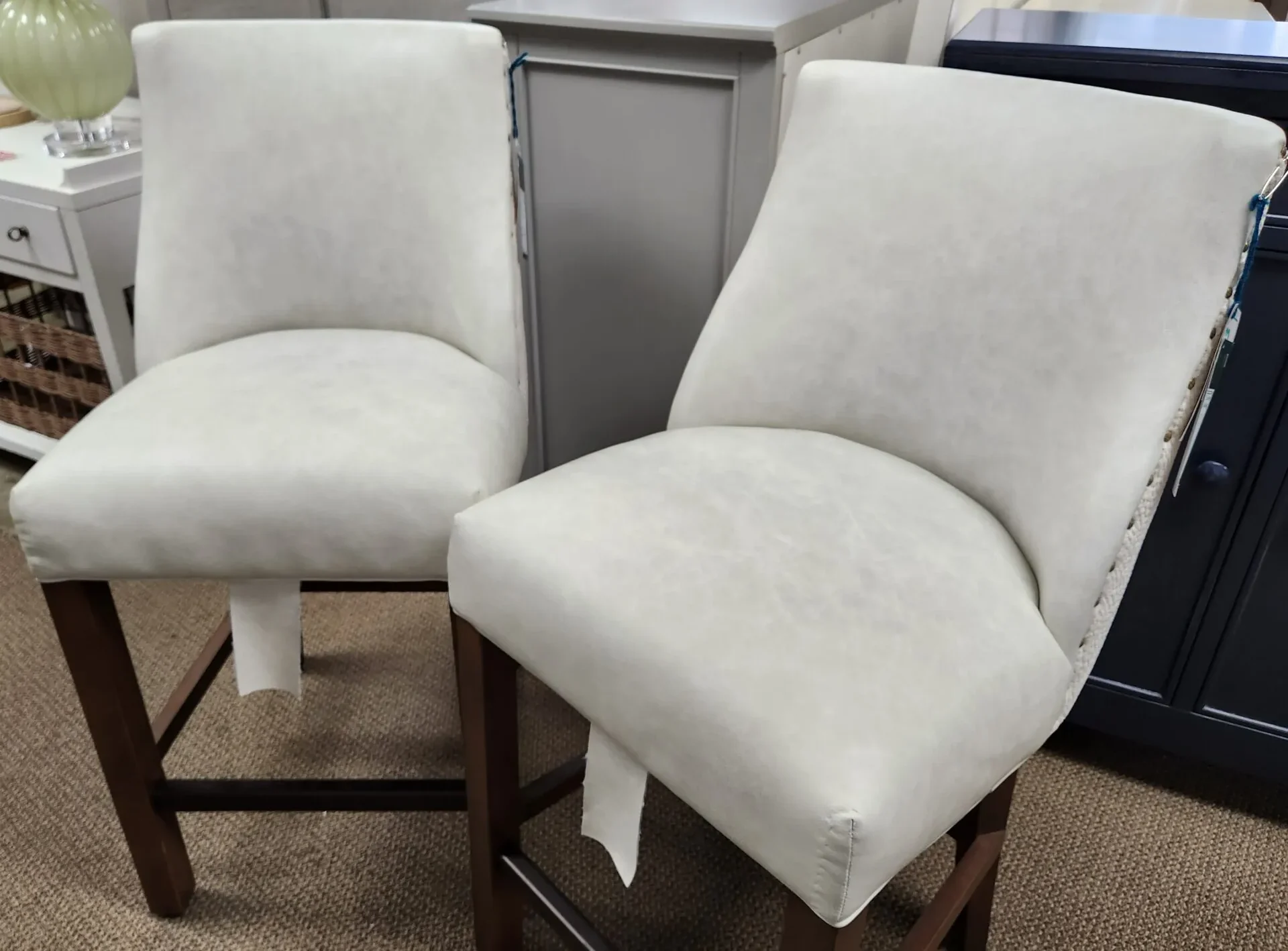 a couple of white chairs sitting next to each other