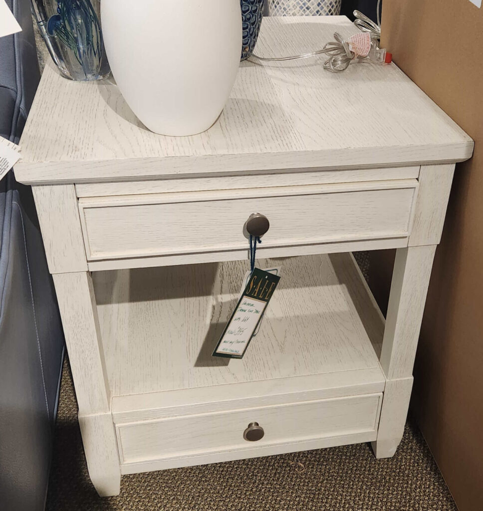 Thumbnail of http://a%20white%20cabinet%20sitting%20on%20top%20of%20a%20floor%20next%20to%20a%20wall