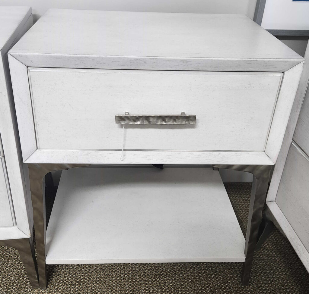 Thumbnail of http://a%20white%20cabinet%20sitting%20next%20to%20a%20wall