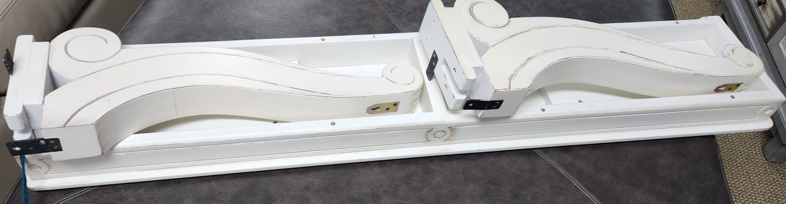 a table that has a piece of furniture on it