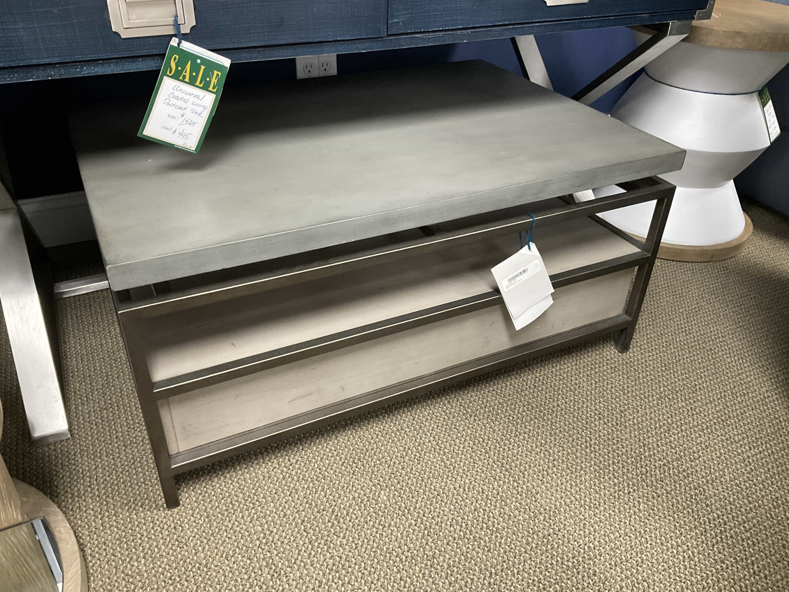 a metal table with a sign on top of it