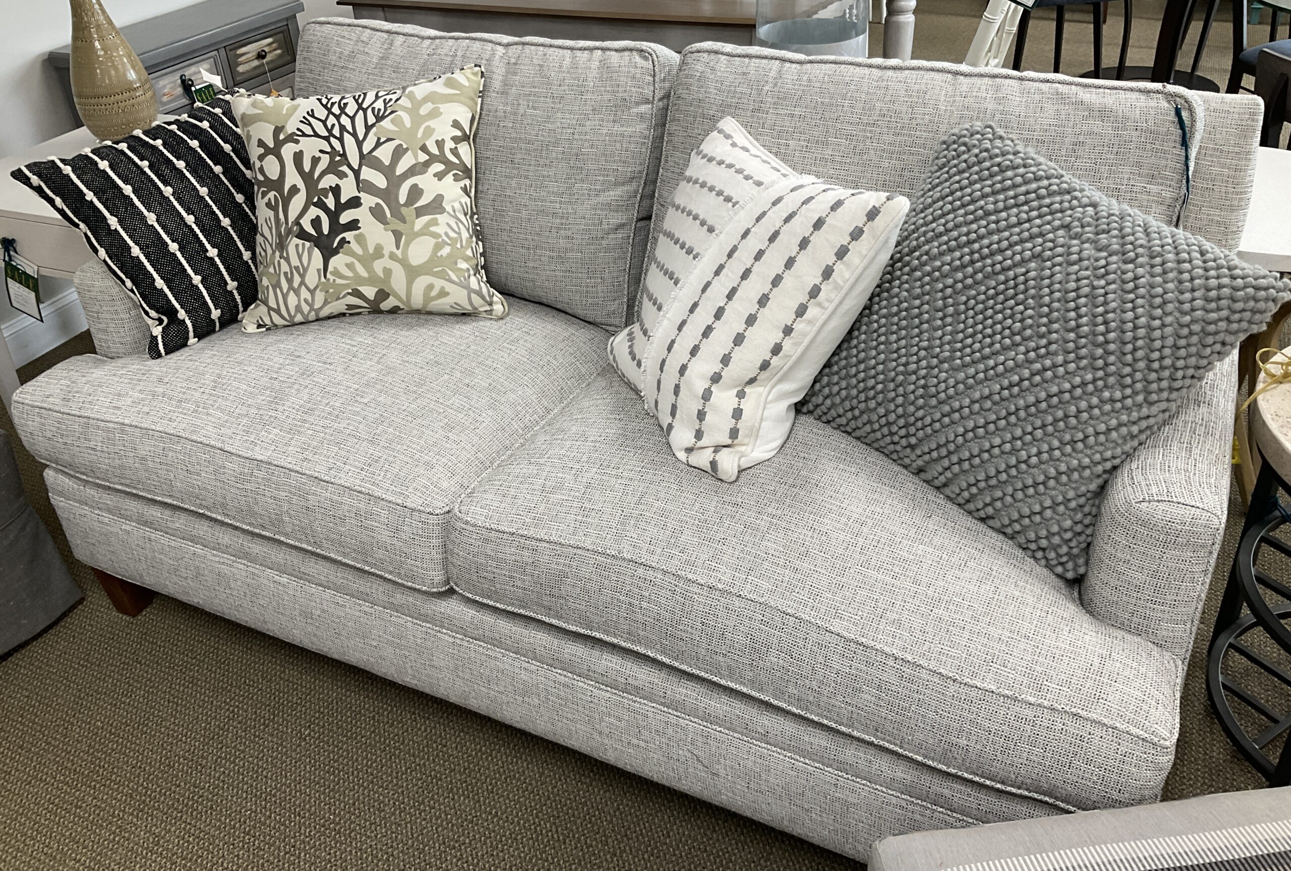 a living room filled with furniture and decor