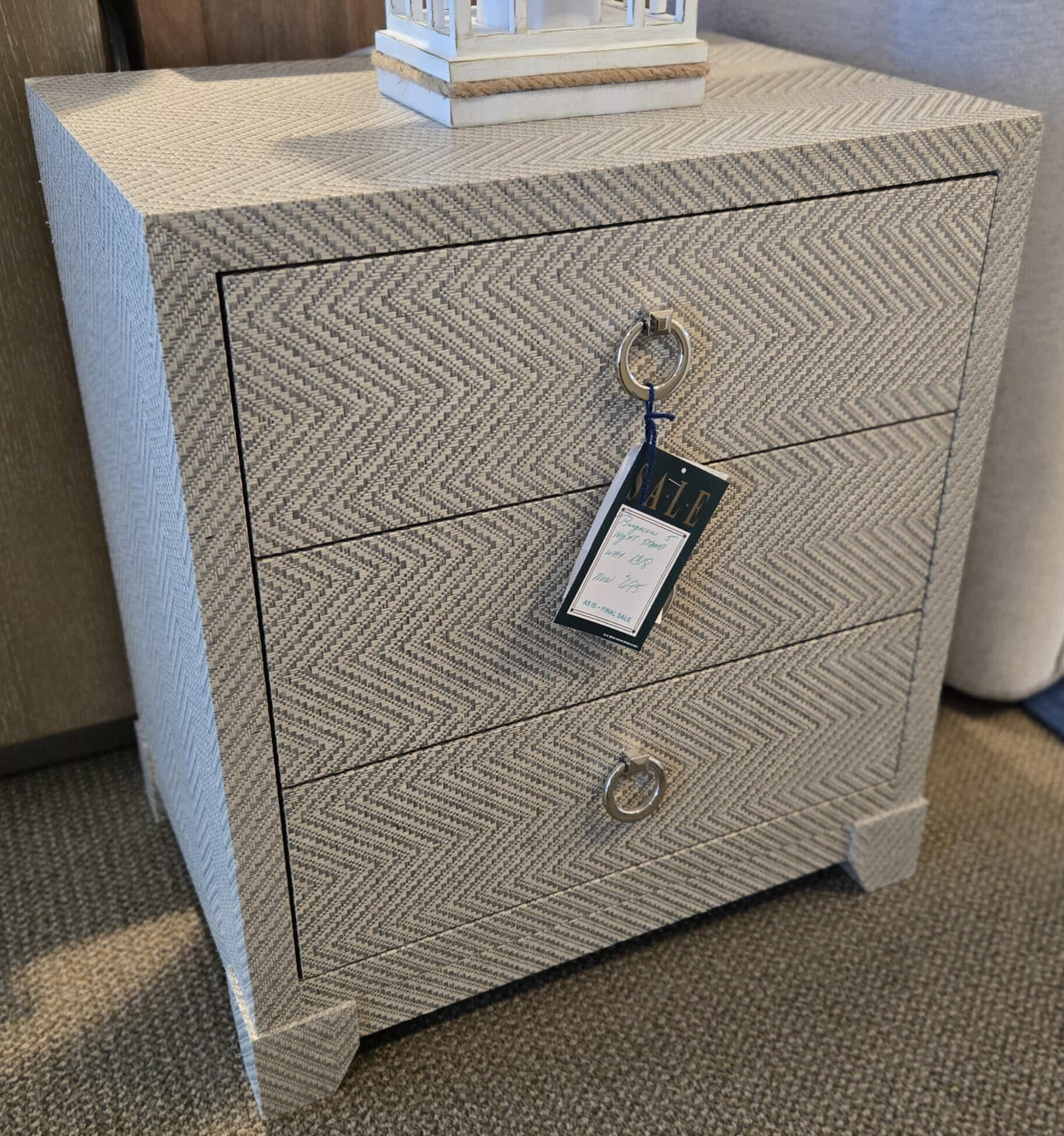 a close up of a couch with a box on it