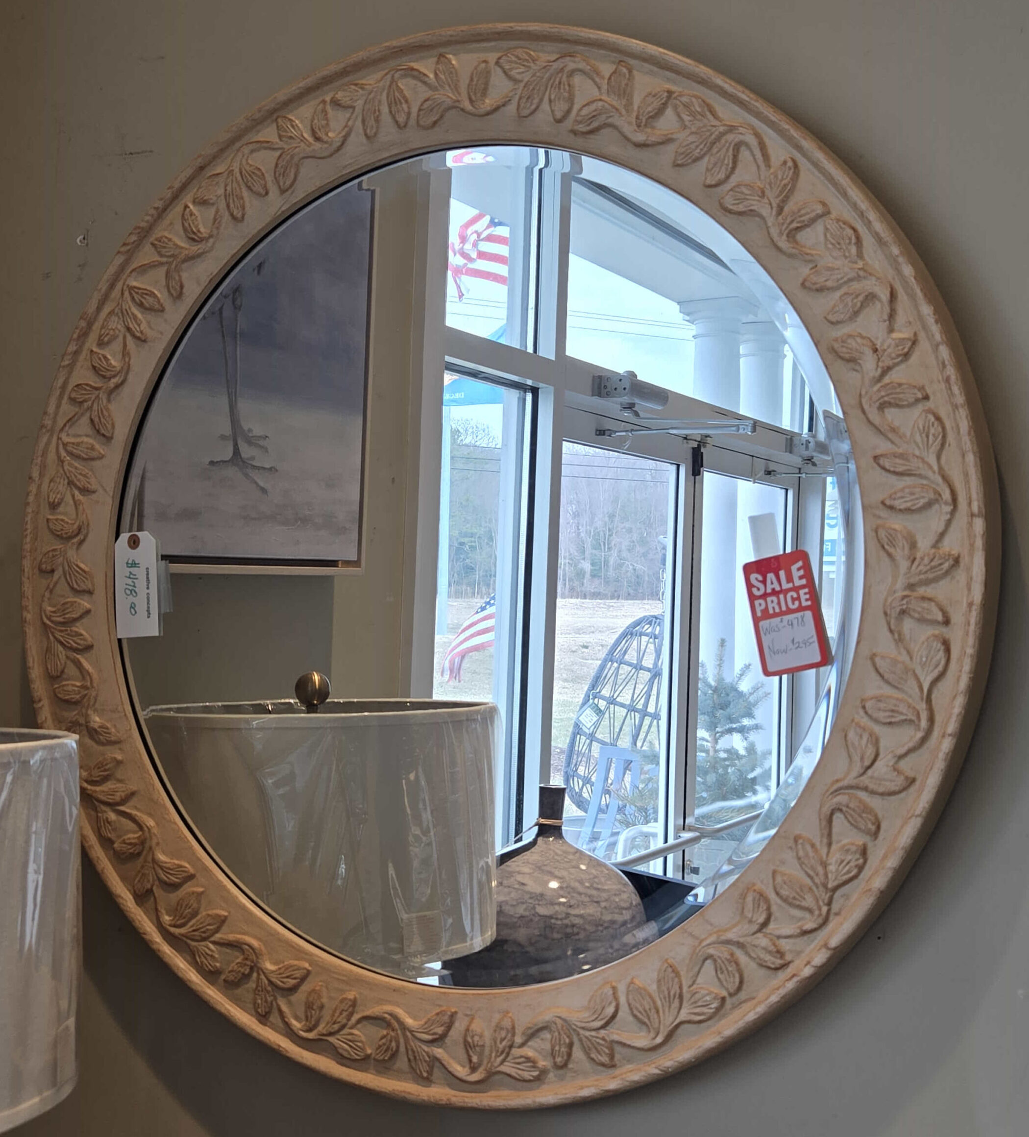 a round mirror sitting on top of a counter