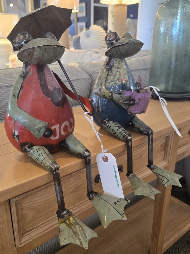 Thumbnail of http://a%20couple%20of%20figurines%20sitting%20on%20top%20of%20a%20wooden%20table