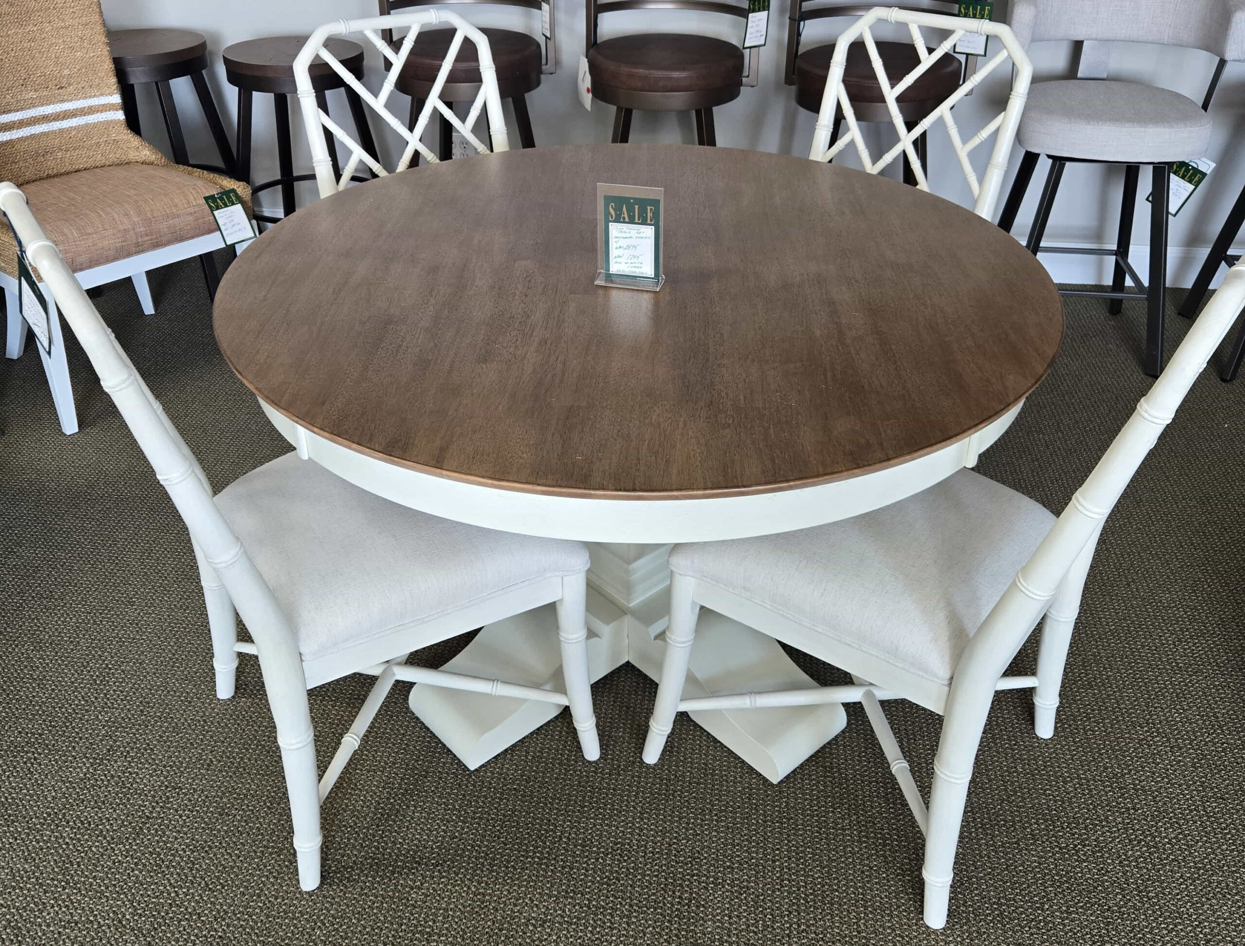 a dining room table with chairs around it