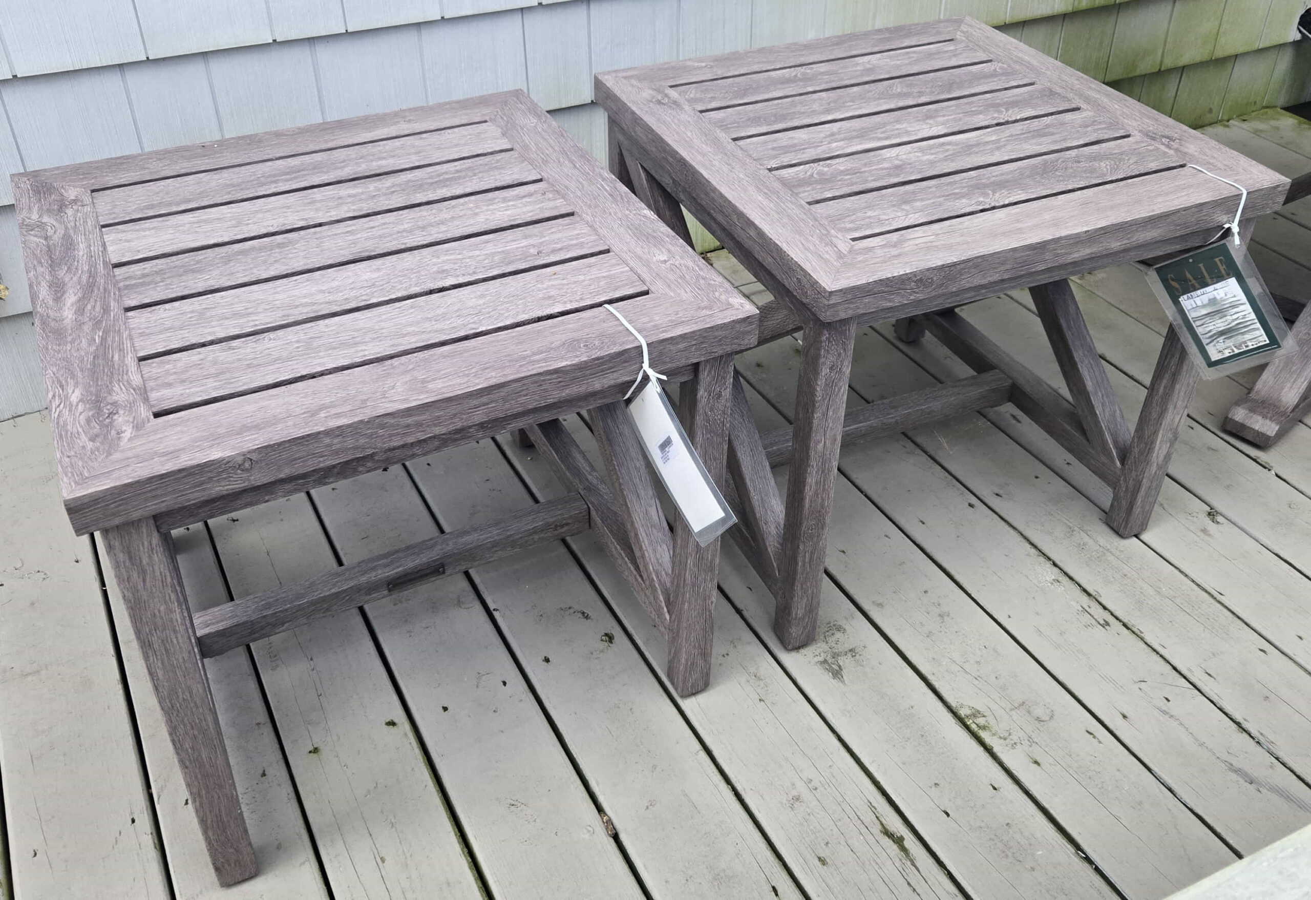a couple of wooden tables sitting on top of a wooden floor