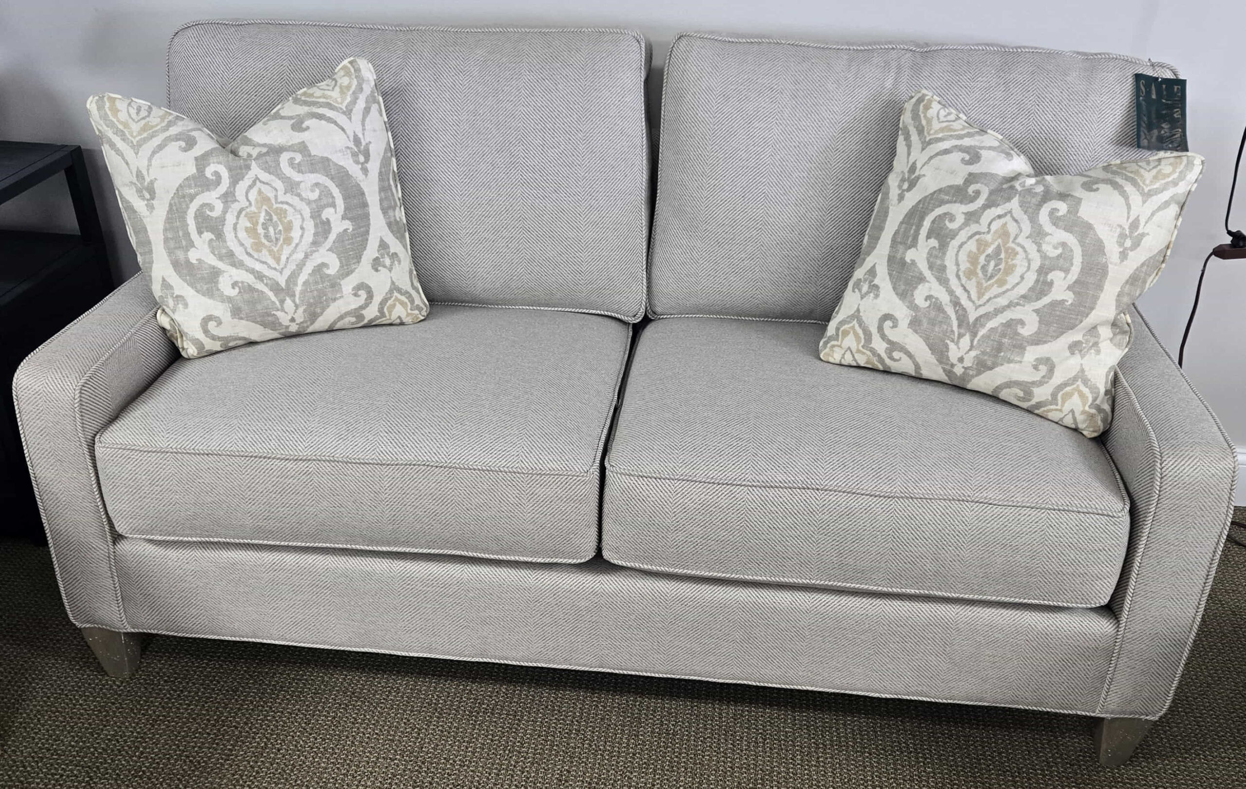 a couch with two pillows on top of it