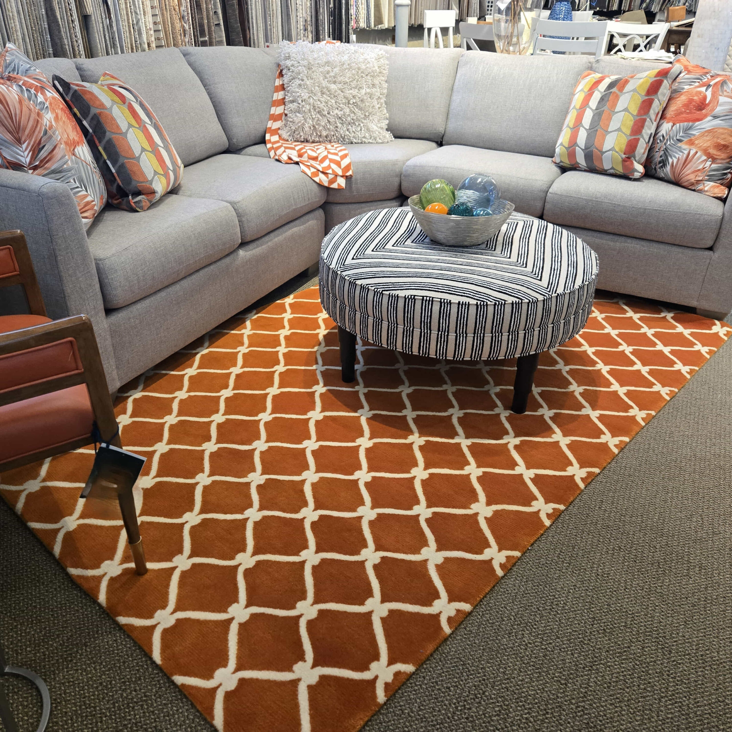 a living room filled with furniture and pillows