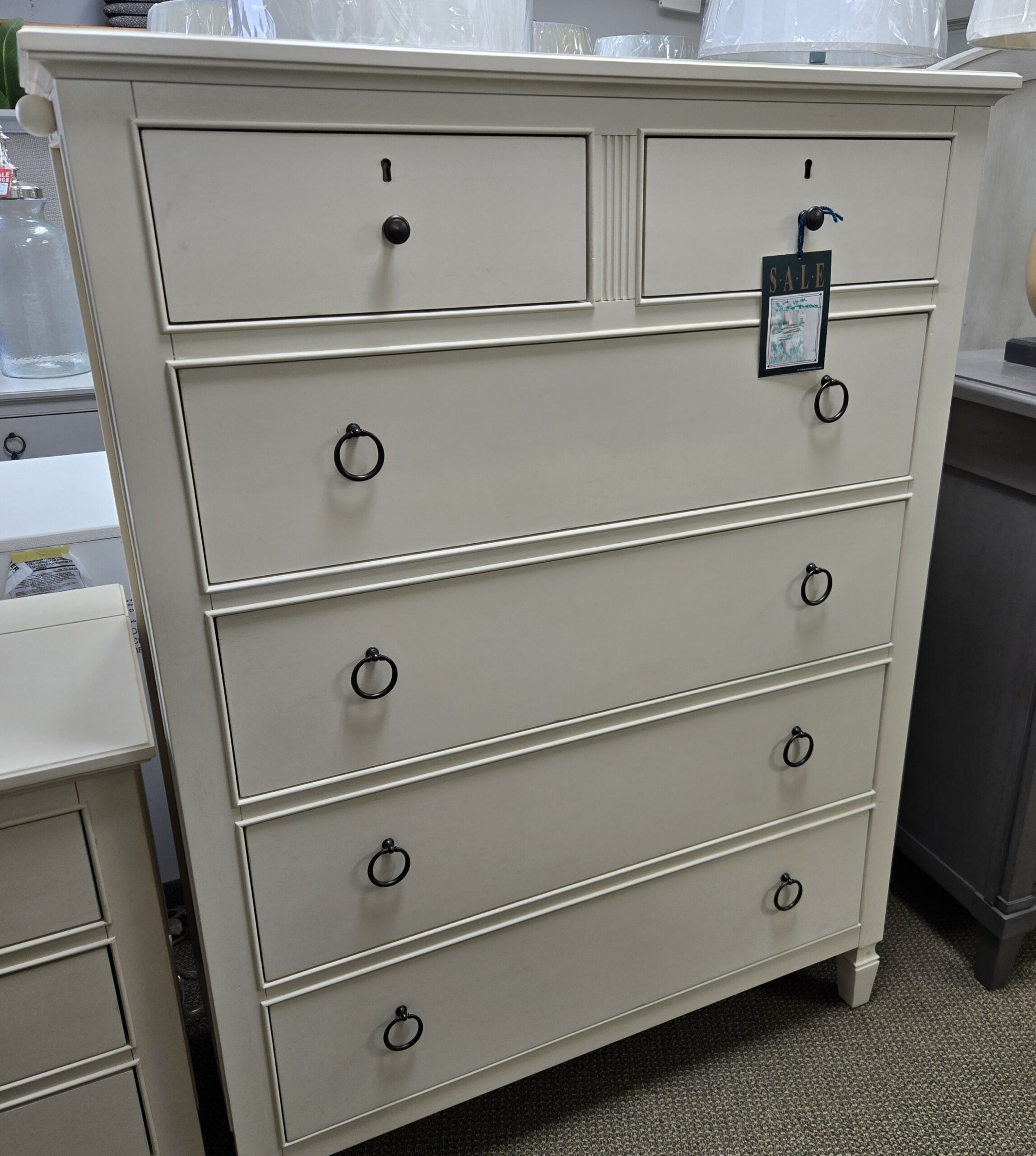a white chest of drawers in a store