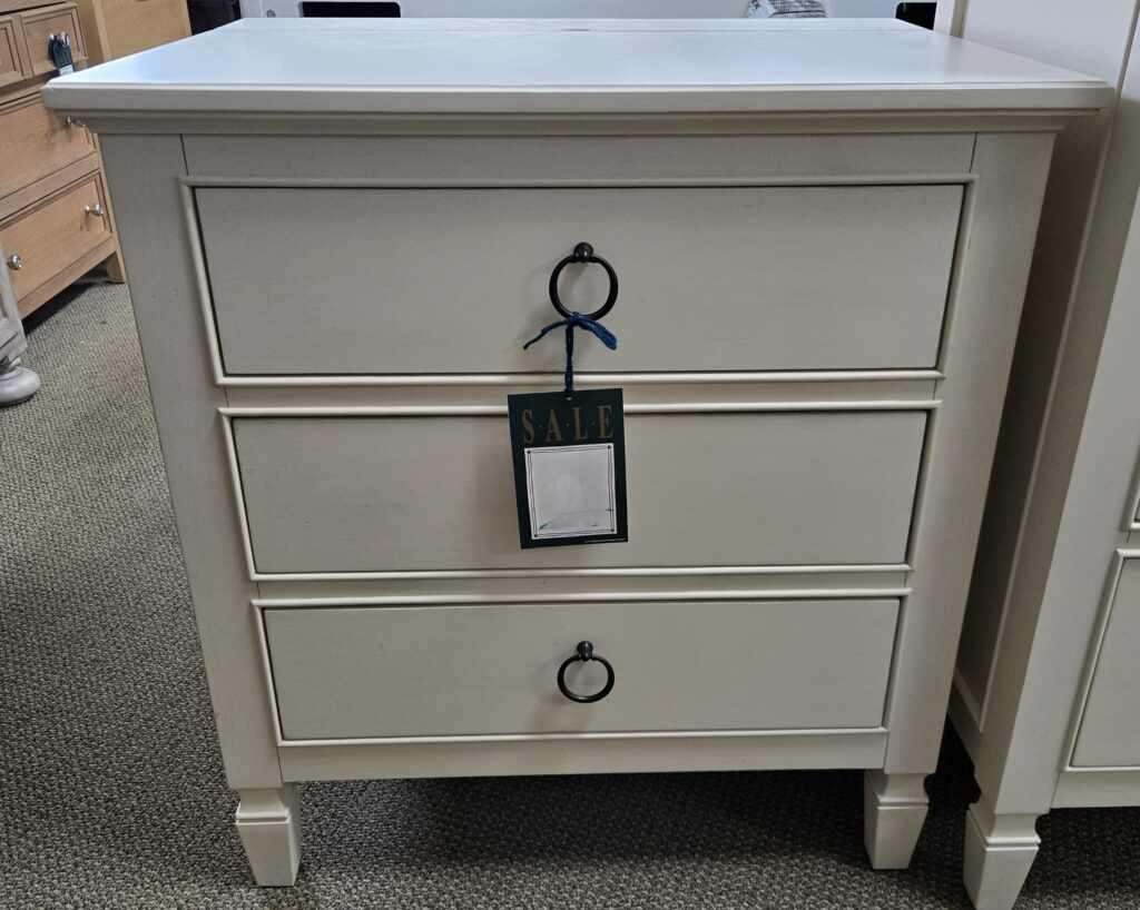 Thumbnail of http://a%20white%20dresser%20with%20a%20black%20tag%20on%20it