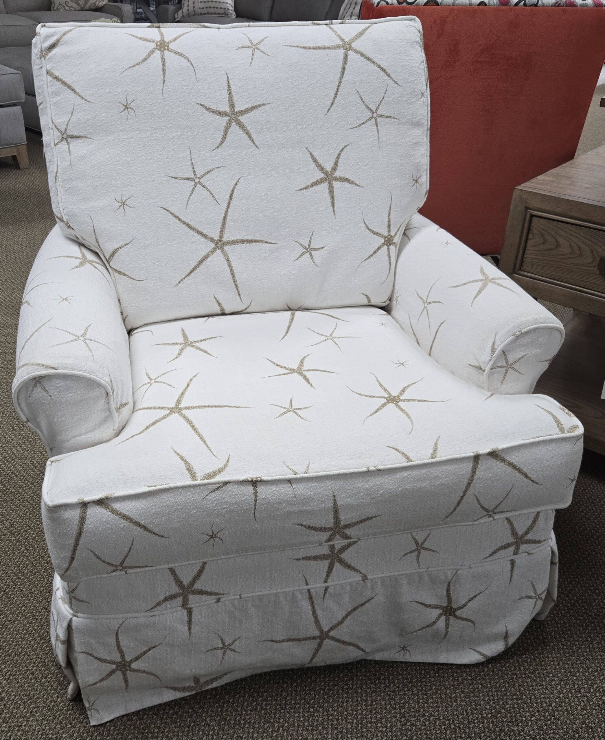 a white chair with a star pattern on it
