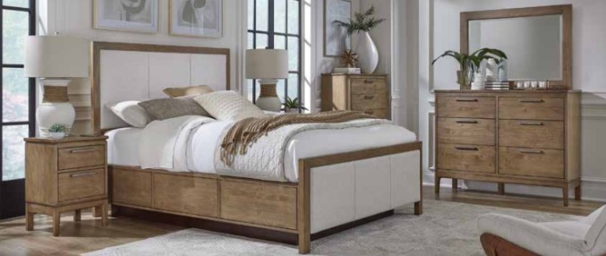 a bedroom scene with focus on the bed and dresser