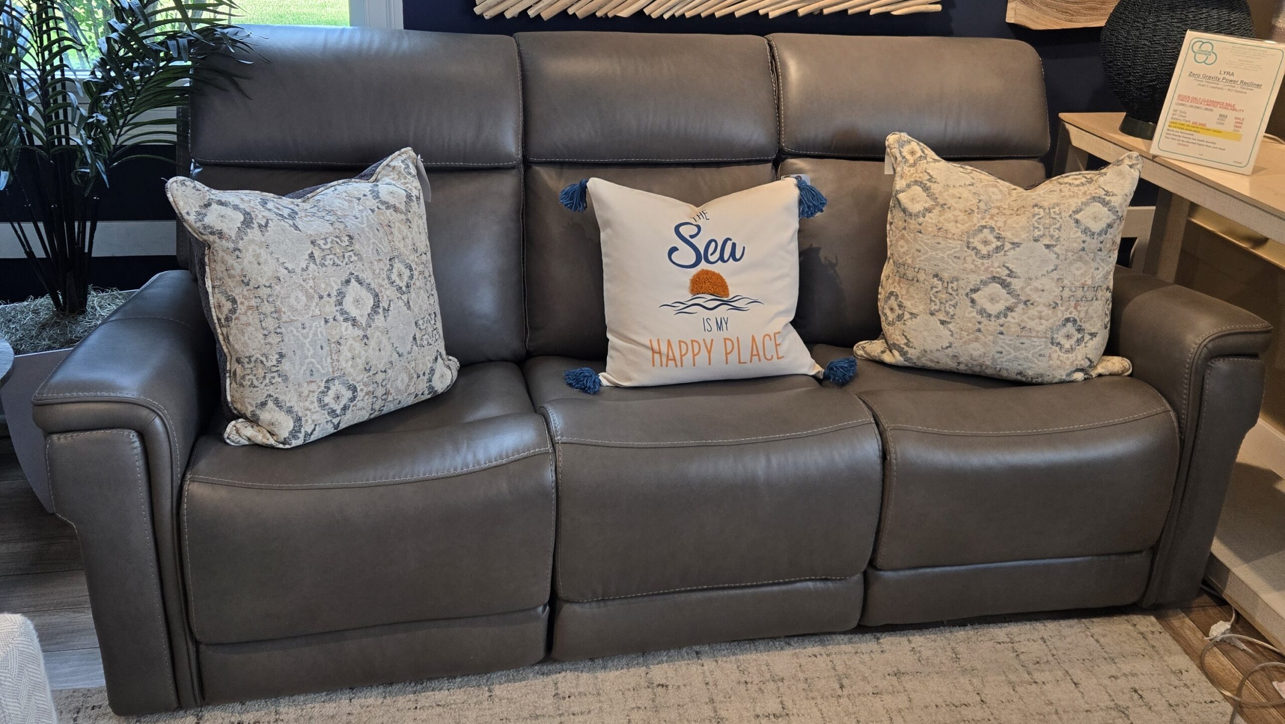 a couch with pillows on it in a store
