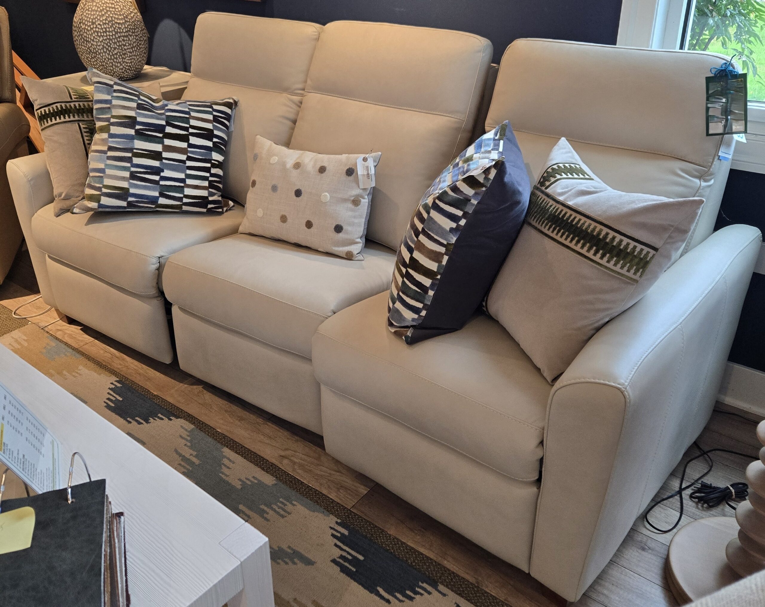 a living room filled with furniture and a large window