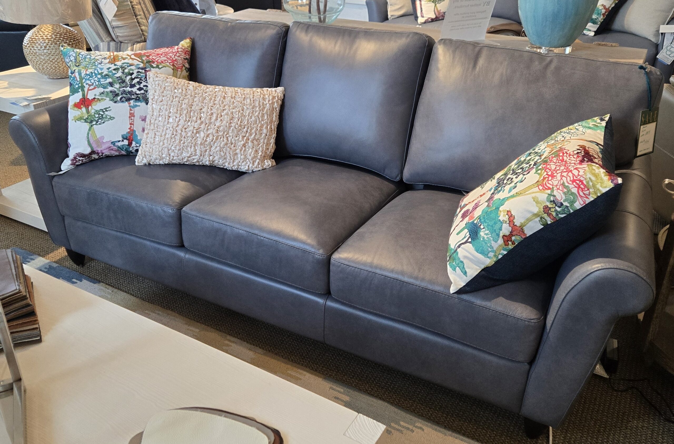 a couch with a lot of pillows on it