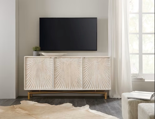 a flat screen tv mounted on a wall in a living room