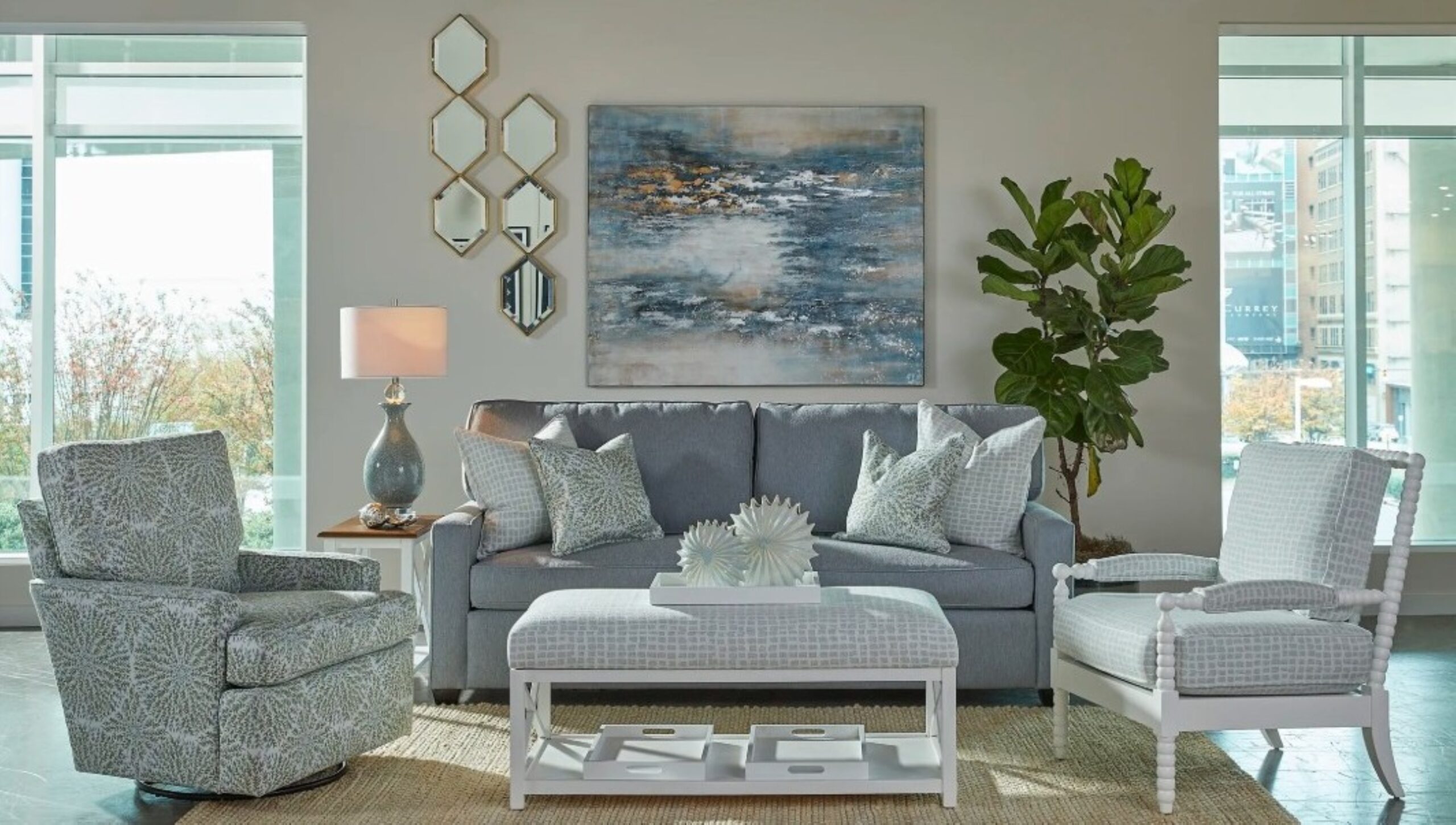 a living room filled with furniture and a large window