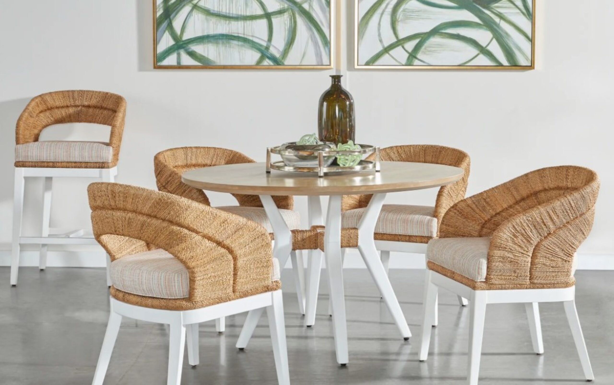 a dining room table with four chairs around it