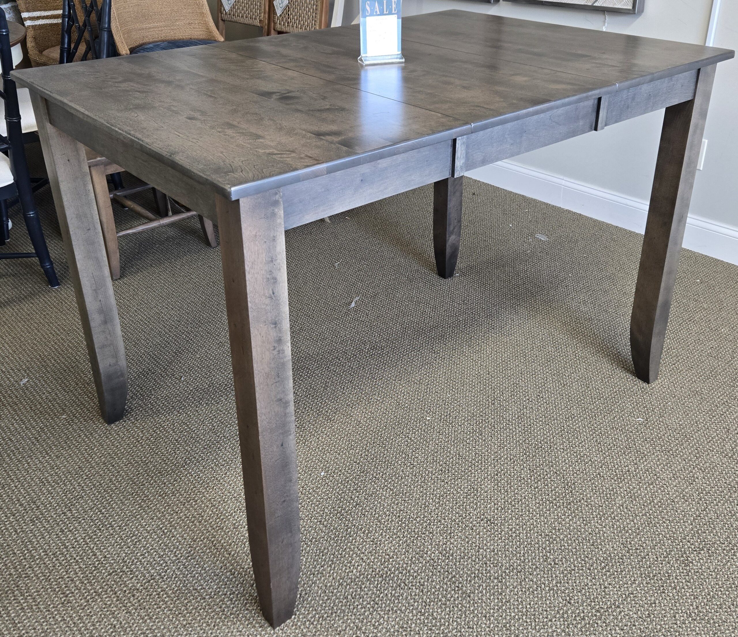 a table with a vase of flowers on top of it