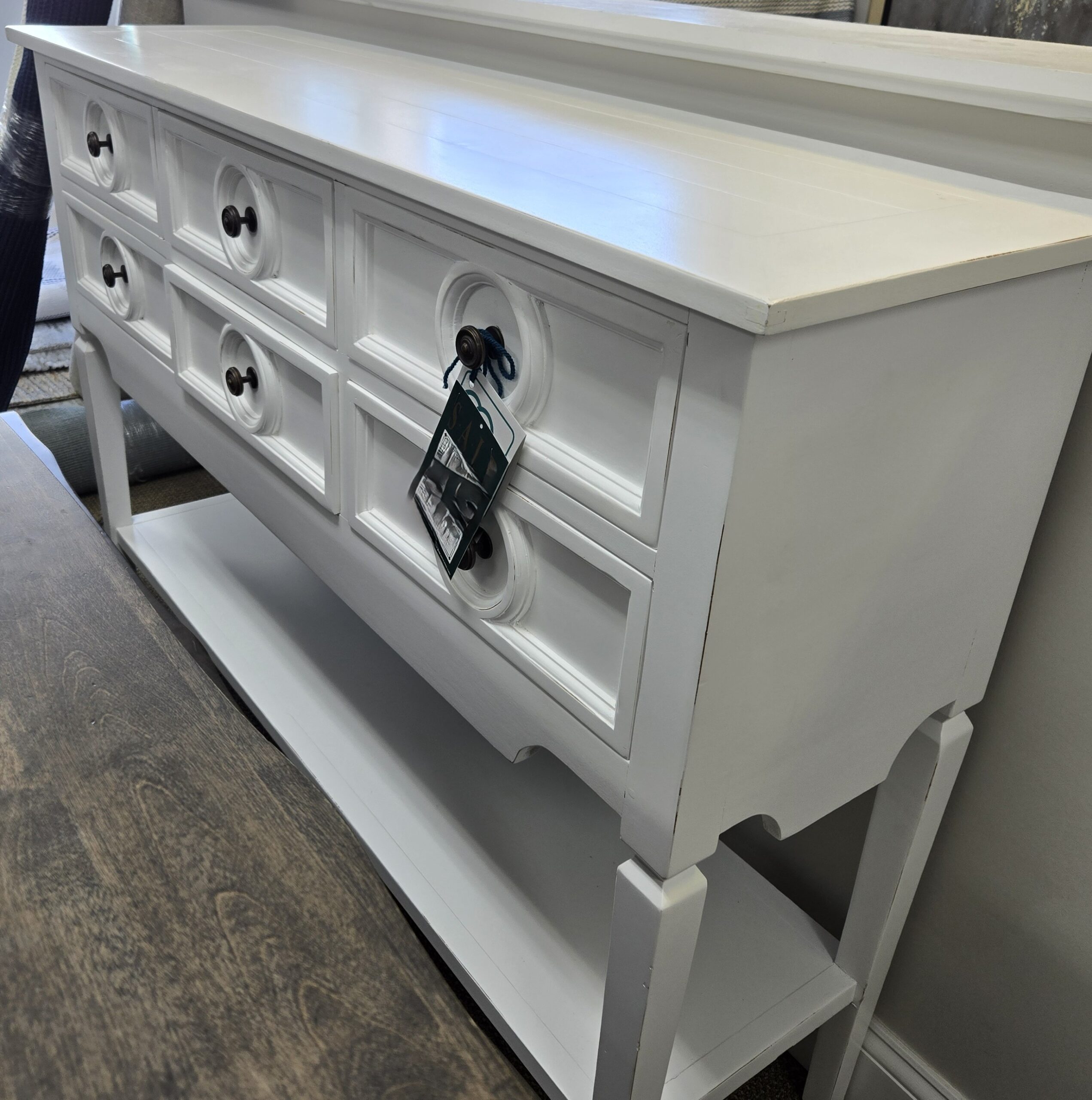 a white dresser with drawers in a room