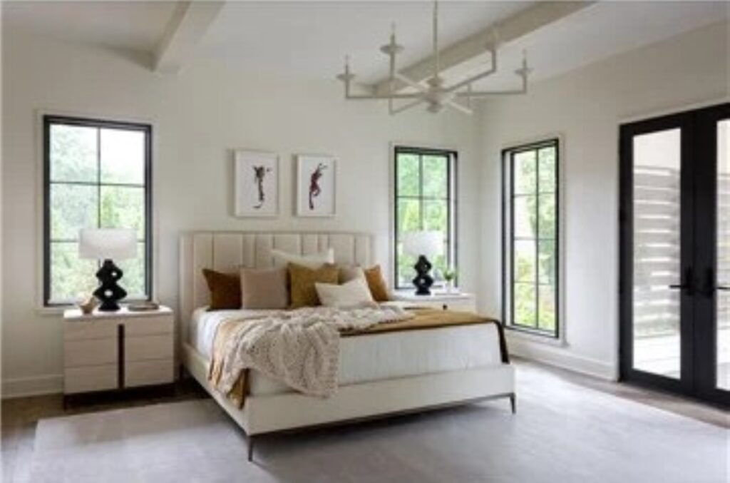 Thumbnail of http://a%20bedroom%20with%20a%20large%20bed%20and%20two%20windows