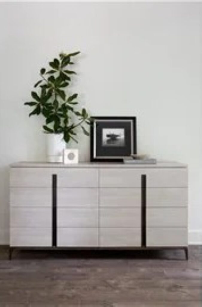 Thumbnail of http://a%20white%20dresser%20with%20a%20plant%20on%20top%20of%20it
